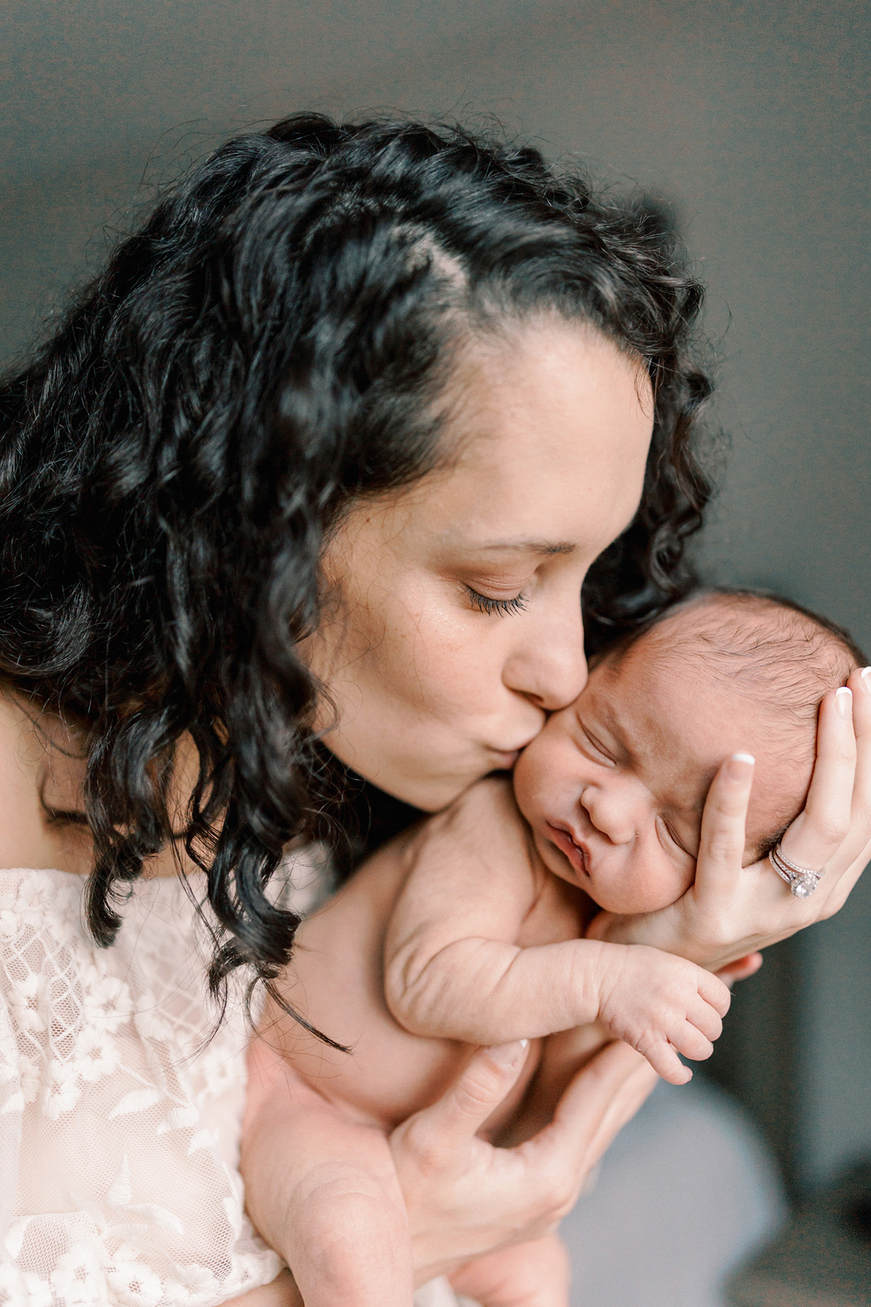 Atlanta Newborn photographer, home sessions, mom kissing baby